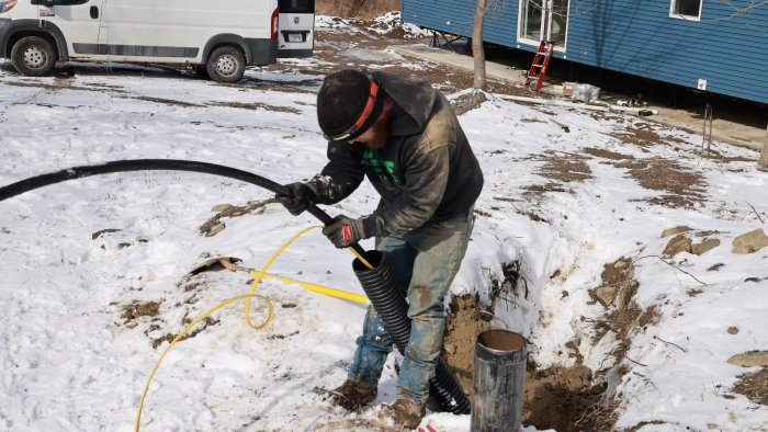 JMS Plumbing technician installing pipes in Cortland NY