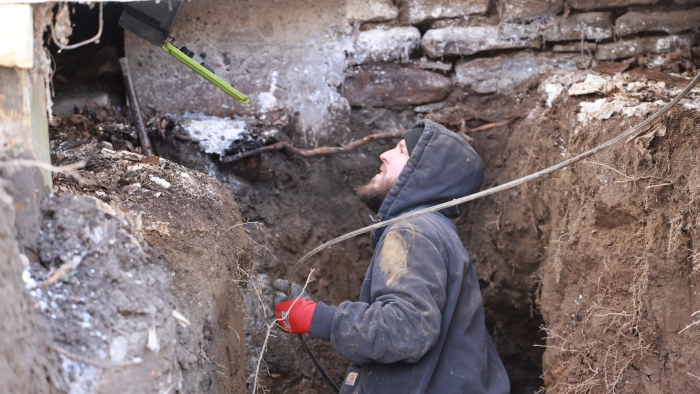 JMS technician working in trench